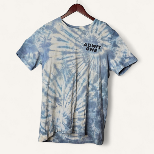 Tie-dye t-shirt with 'ADMIT ONE' text on a hanger against a white background