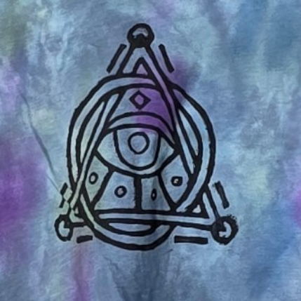 Tie-dye t-shirt with a symbol on a hanger against a white background