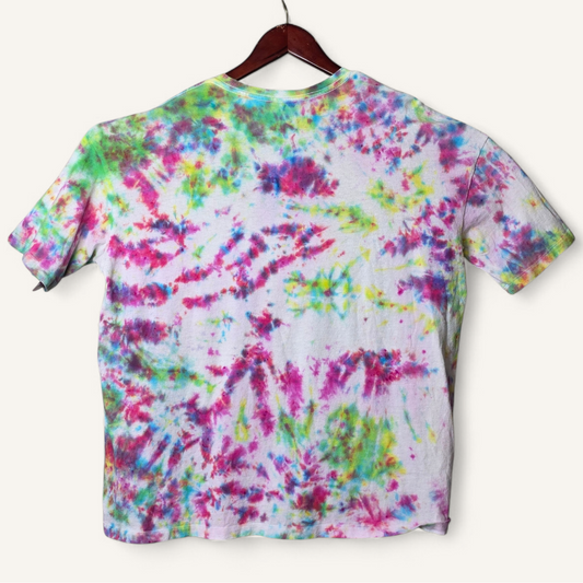 Colorful tie-dye t-shirt on a hanger against a white background