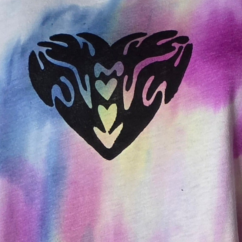 Tie-dye shirt with a black heart design featuring colorful hearts inside.