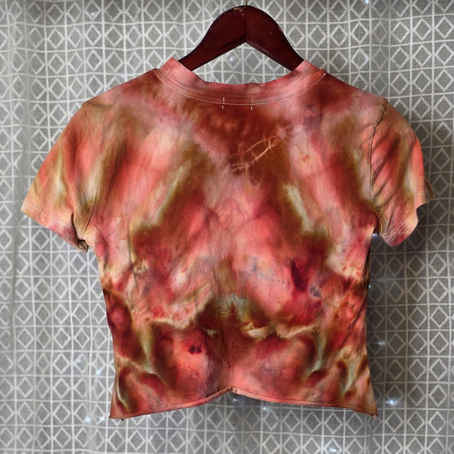 Tie-dye shirt on a textured surface
