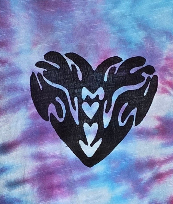 Black heart-shaped design on a tie-dye background with pink and blue hues
