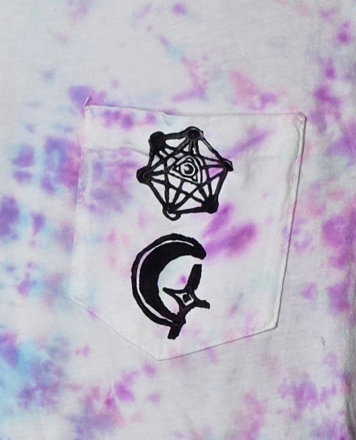 Tie-dye shirt with black geometric designs on a pocket
