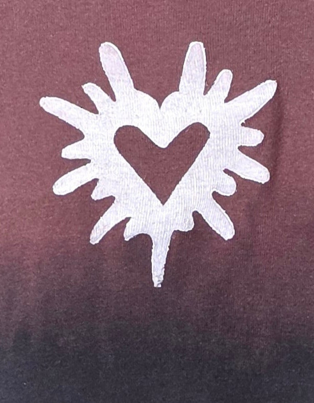 White abstract heart design on a maroon background