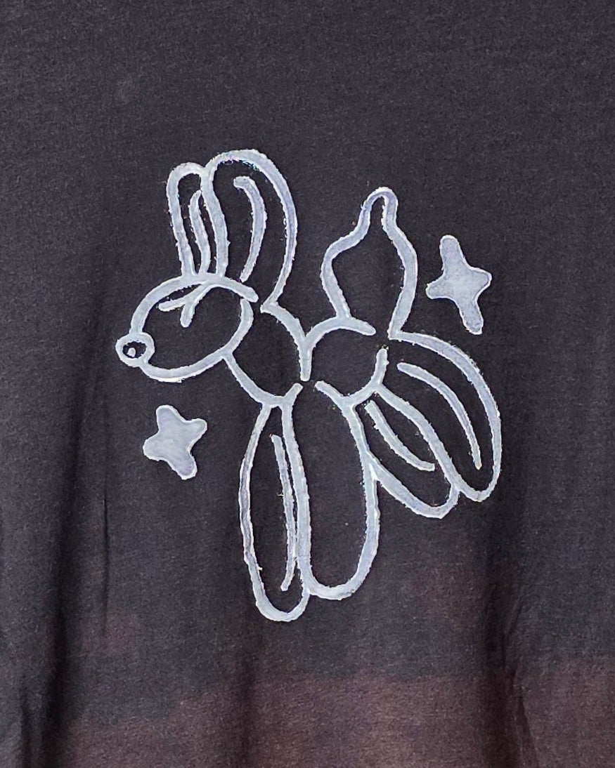 Black t-shirt with a balloon animal graphic.